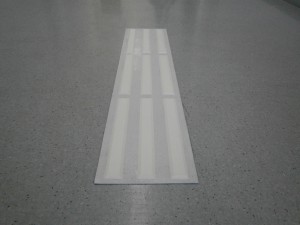 white tactile pad with white strips